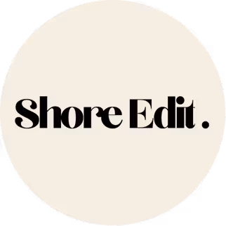 Shore Edit text logo in black on a light beige circular background.